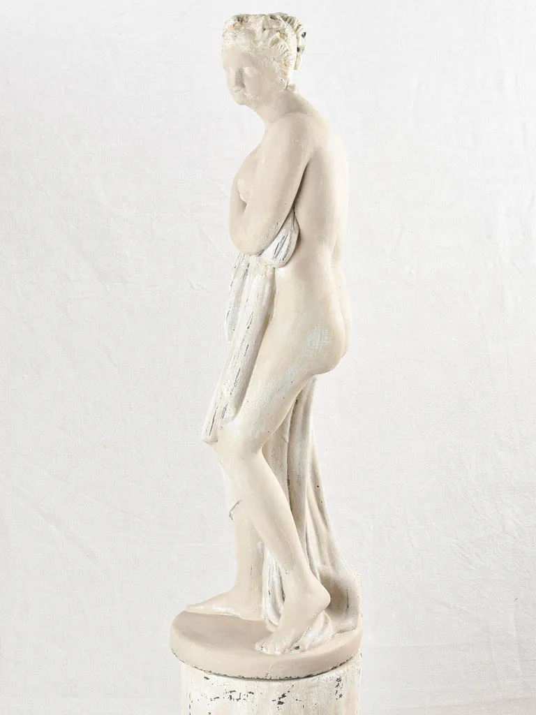 Art Deco style figurative statue on pedestal