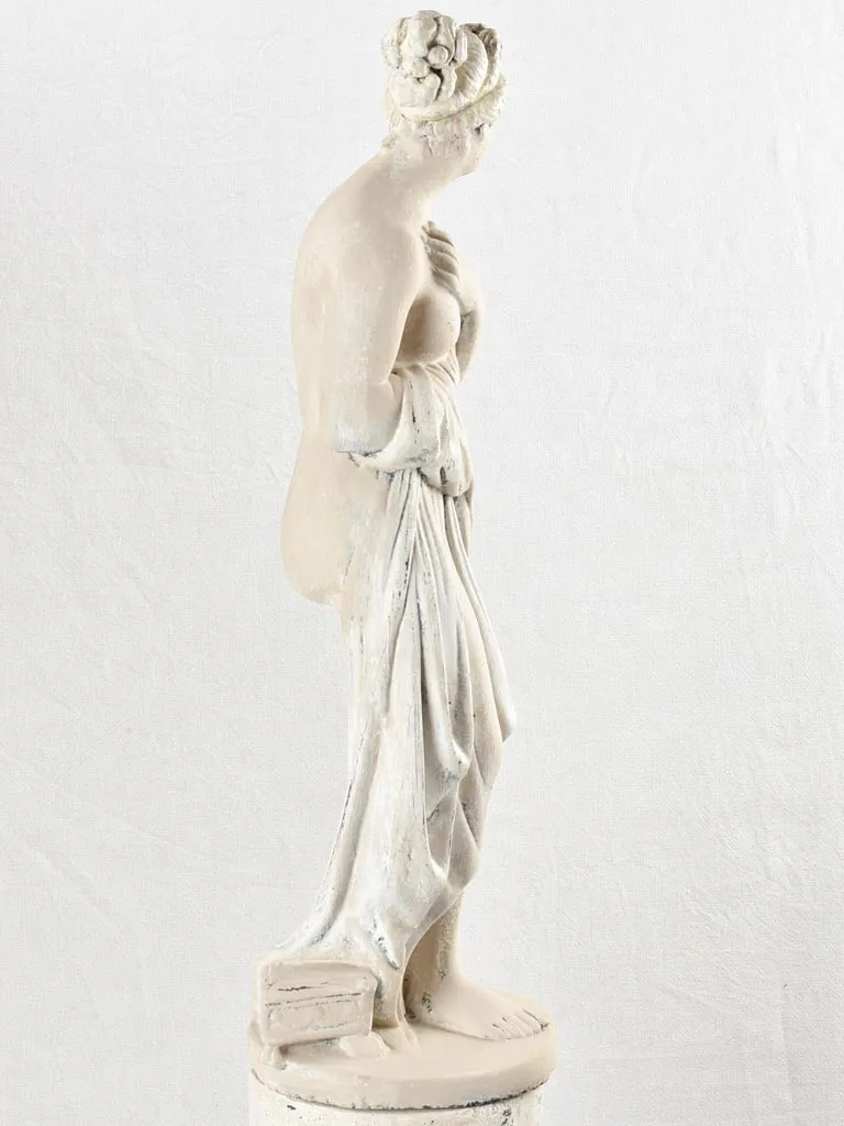 Art Deco style figurative statue on pedestal