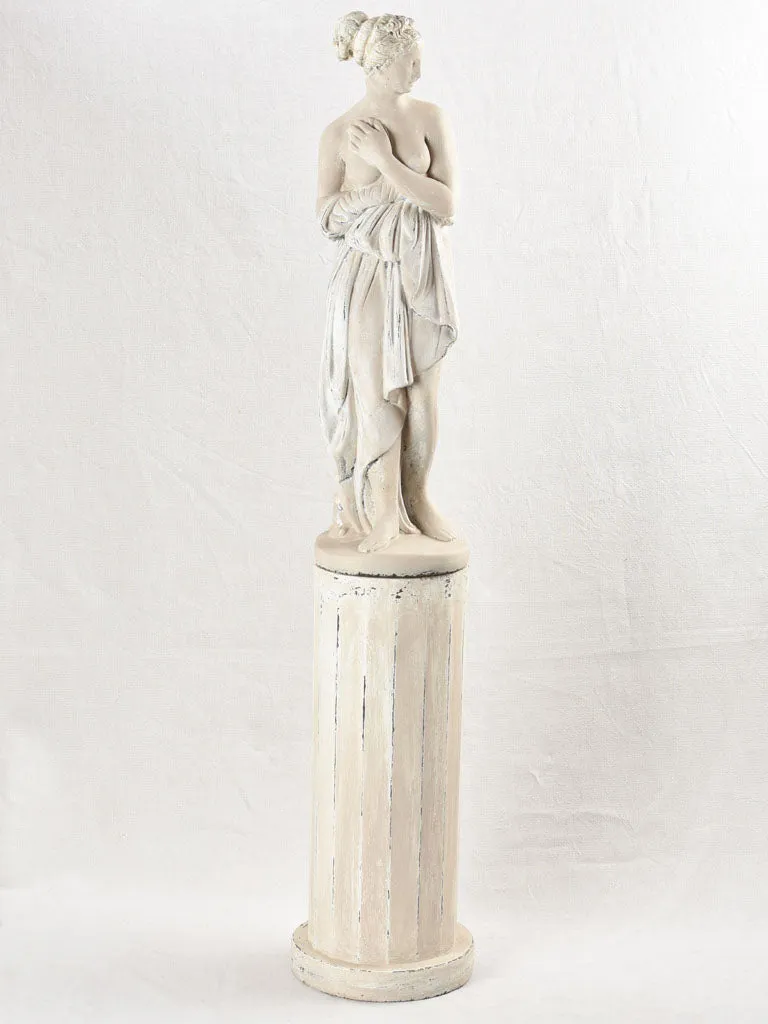 Art Deco style figurative statue on pedestal